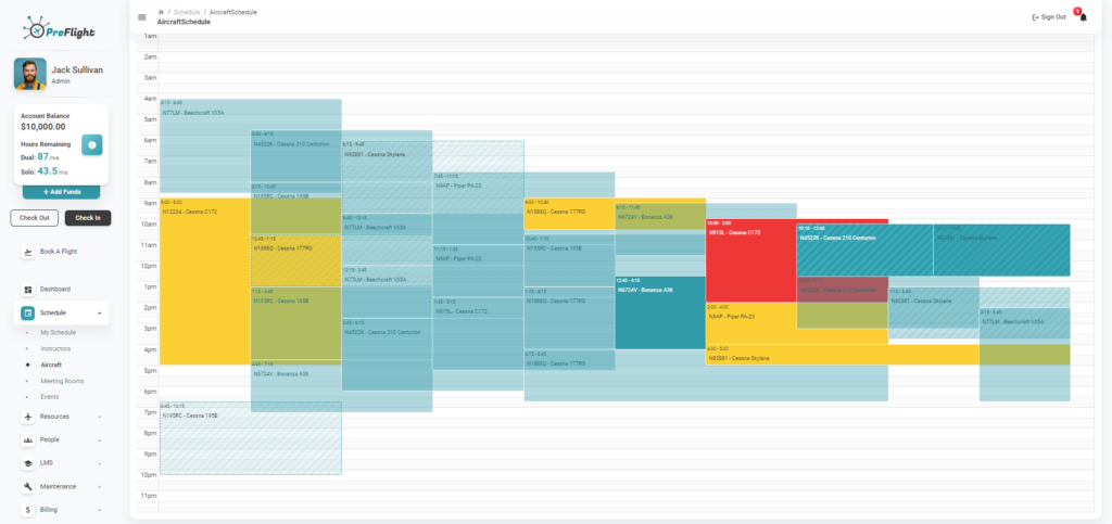 Screenshot of the PreFlight scheduling interface showing the aircraft schedule for a specific day. The user profile, account balance, and navigation menu are visible on the left side of the screen. The main area displays a time grid from 12 AM to 11 PM, with color-coded blocks indicating the scheduled use of various aircraft. Each block contains details about the aircraft model, such as 'N18880 - Cessna 177RG' and 'N4522K - Cessna 210 Centurion,' along with the scheduled times. The schedule includes various activities, with overlapping reservations showing different usage slots. The navigation menu on the left includes options like 'Dashboard,' 'Schedule,' 'Aircraft,' 'Resources,' 'People,' 'LMS,' 'Maintenance,' and 'Billing.