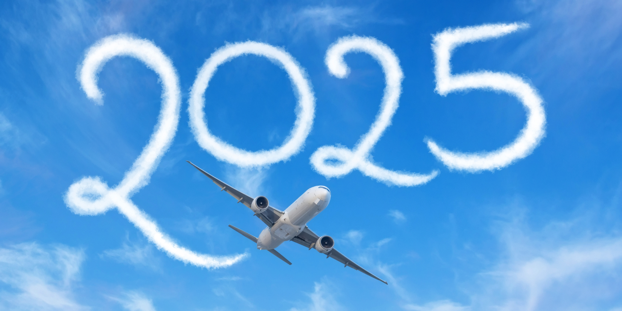 An airplane soaring through a clear blue sky with the year '2025' drawn in skywriting clouds. Represents the future of efficient flight planning and the need for a modern Aviation Scheduler to streamline operations.